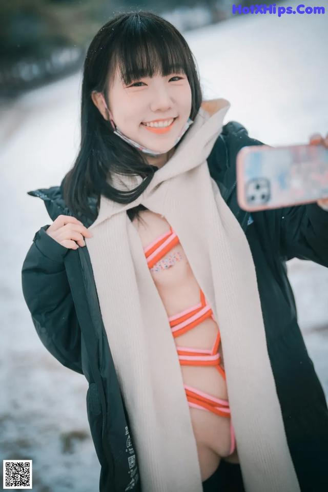 A woman taking a selfie in the snow.