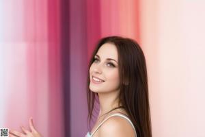 A woman in a white bra is posing for a picture.