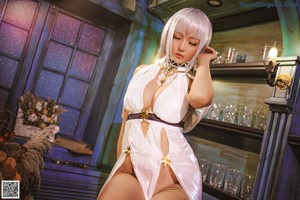 A woman sitting on top of a table holding a glass of wine.
