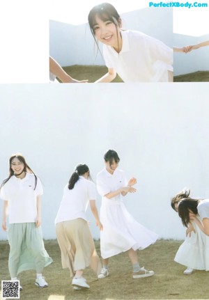 A group of young women standing next to each other on a field.